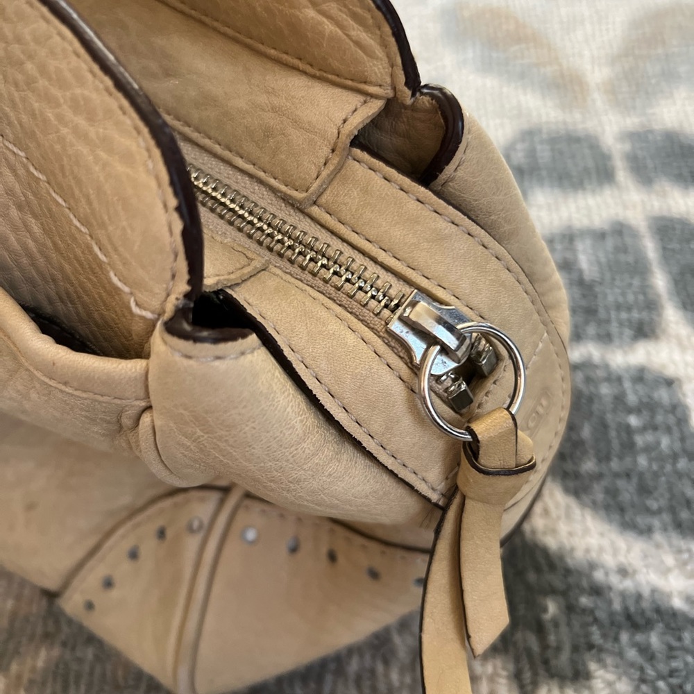 Classic Coach satchel in a soft cream color that goes with everything